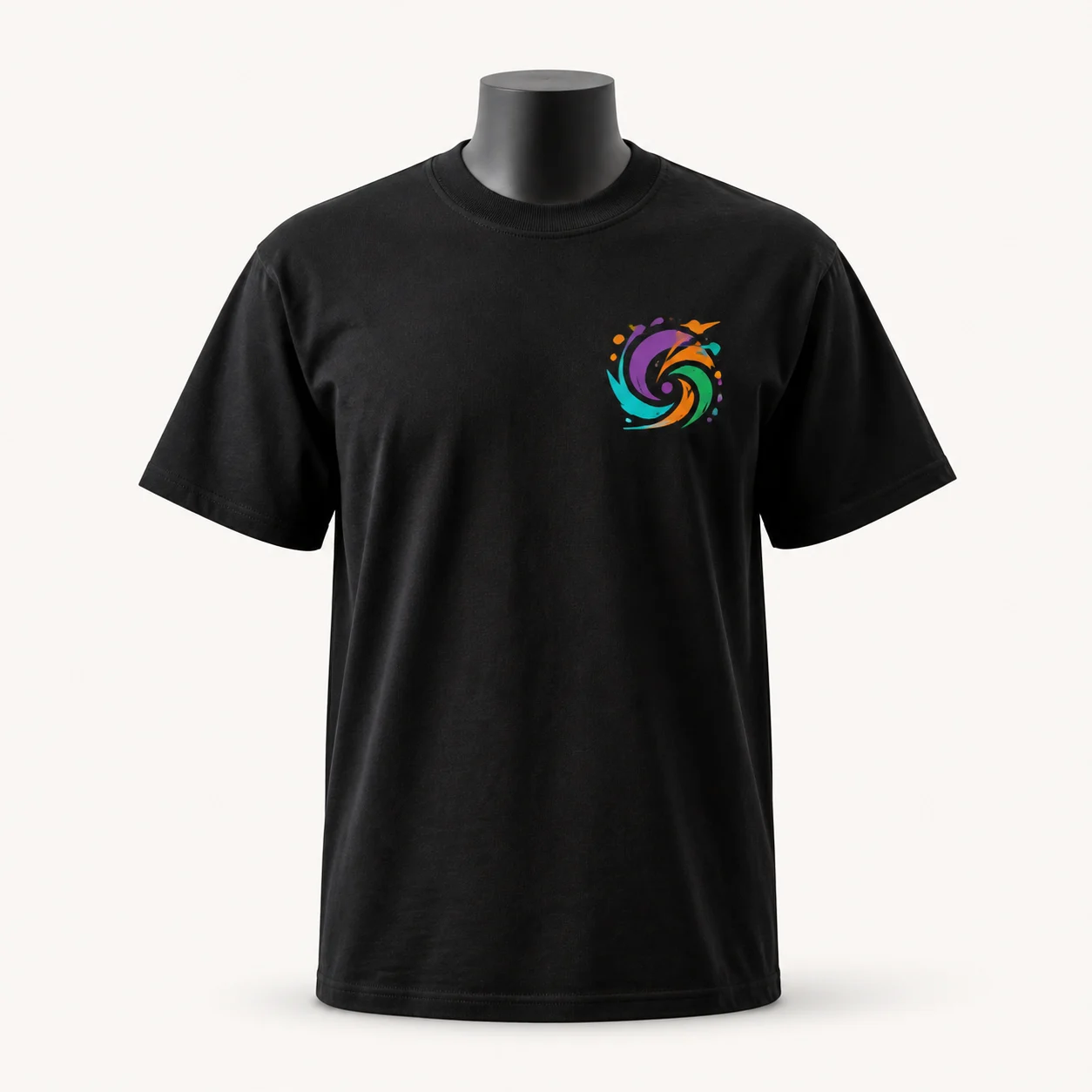 Illustrative mockup of a black T-shirt with a small colorful abstract DTF print on the wearer’s left chest